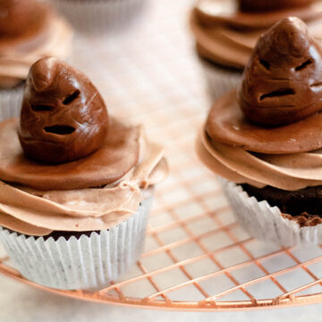 Sorting hat cupcakes sitting on a brass tray
