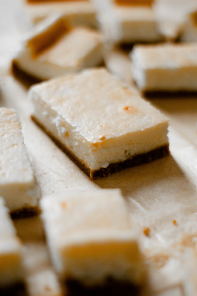 Gluten Free Recipe for Cheesecake Bars on parchment paper