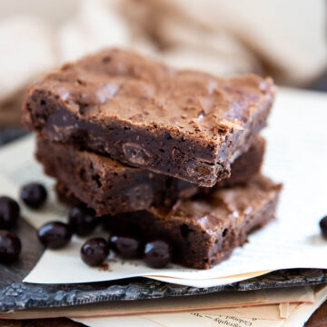 Espresso brownies in a pile on a plate.