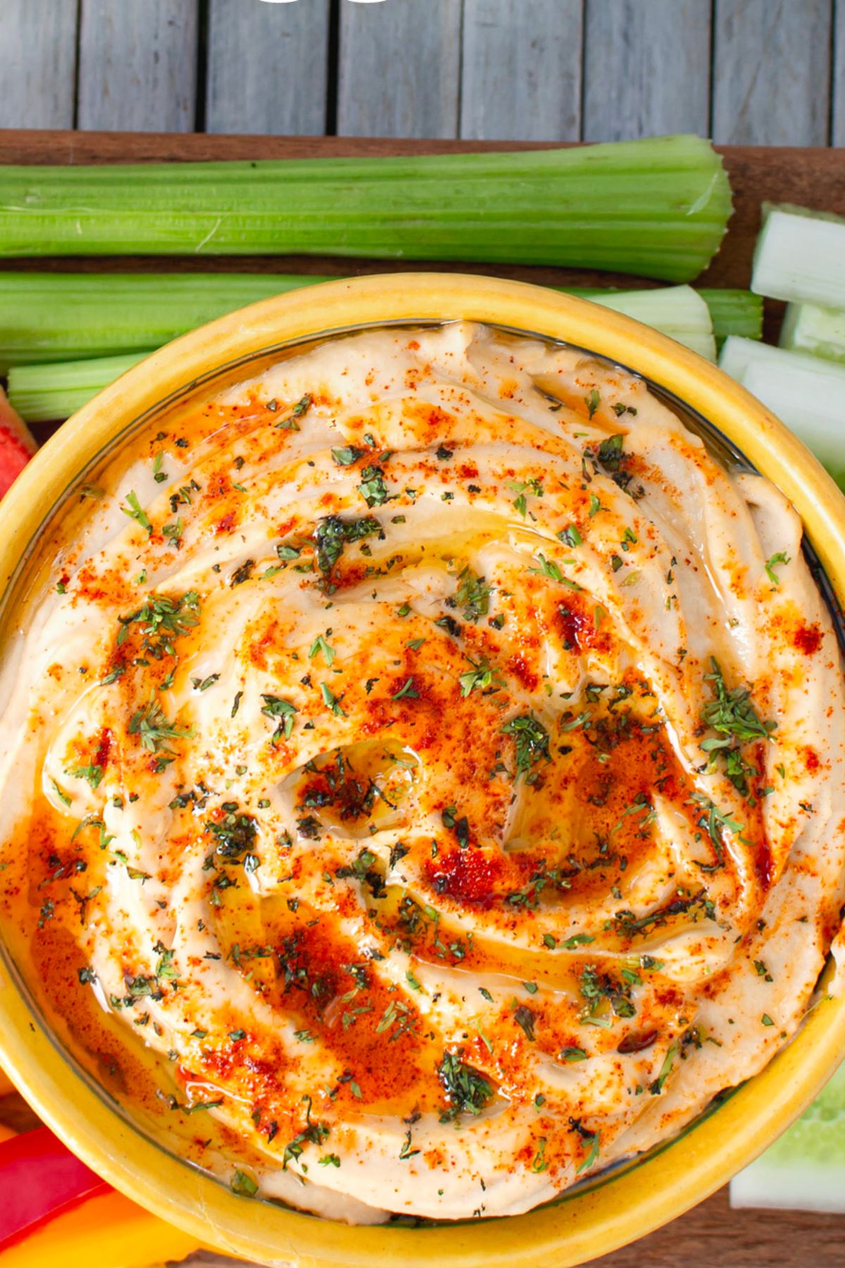 Gluten Free Hummus Recipe with parsley in a yellow bowl