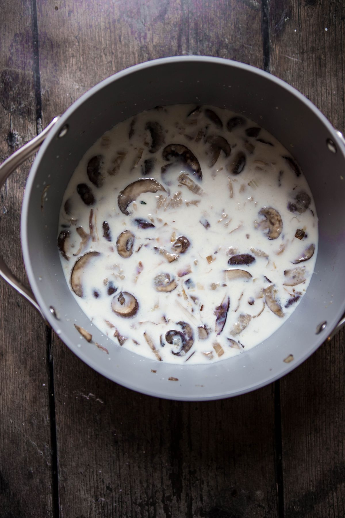 mushrooms in milk in a pot