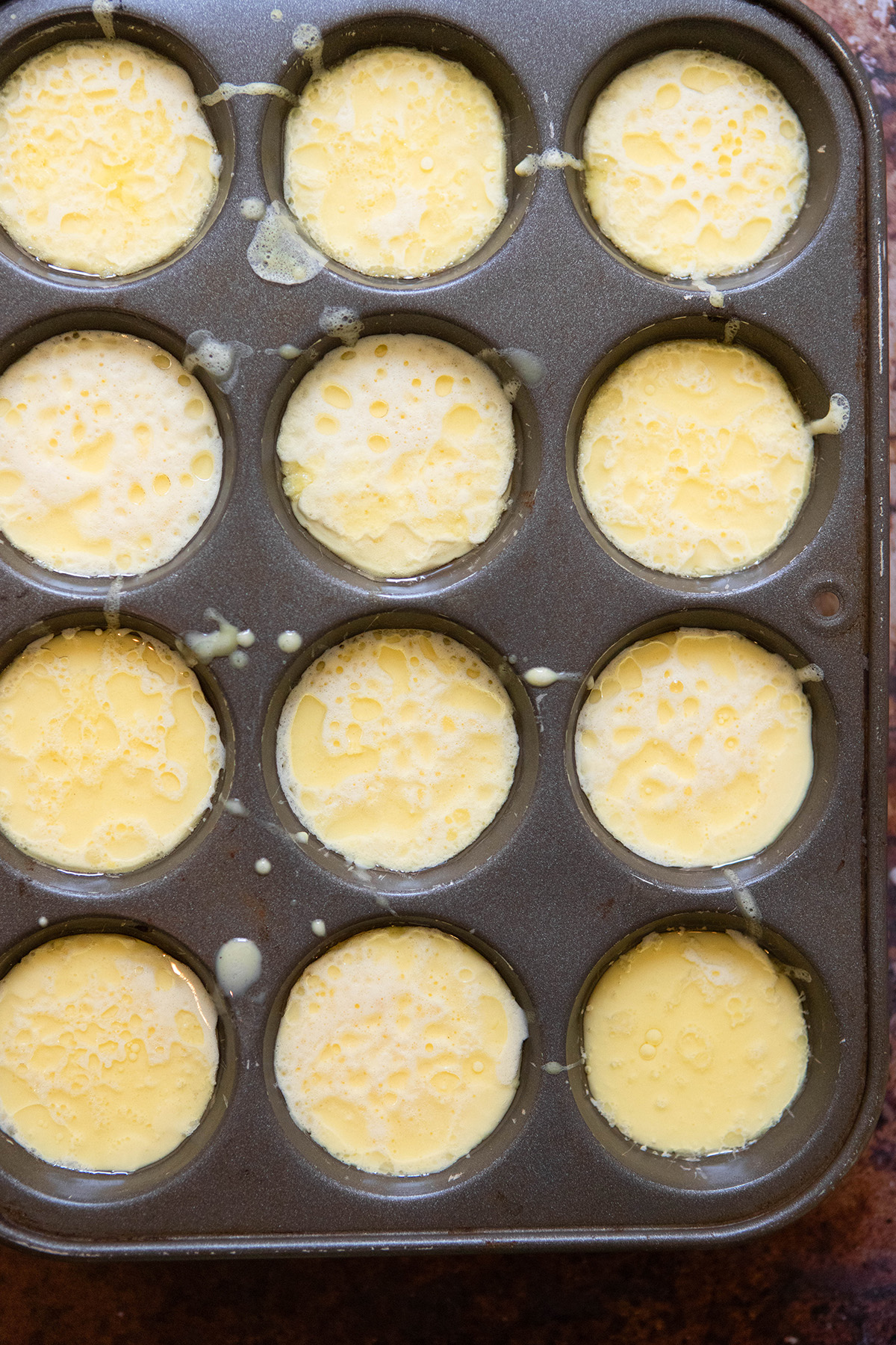gluten free yorkshire pudding batter in muffin tin