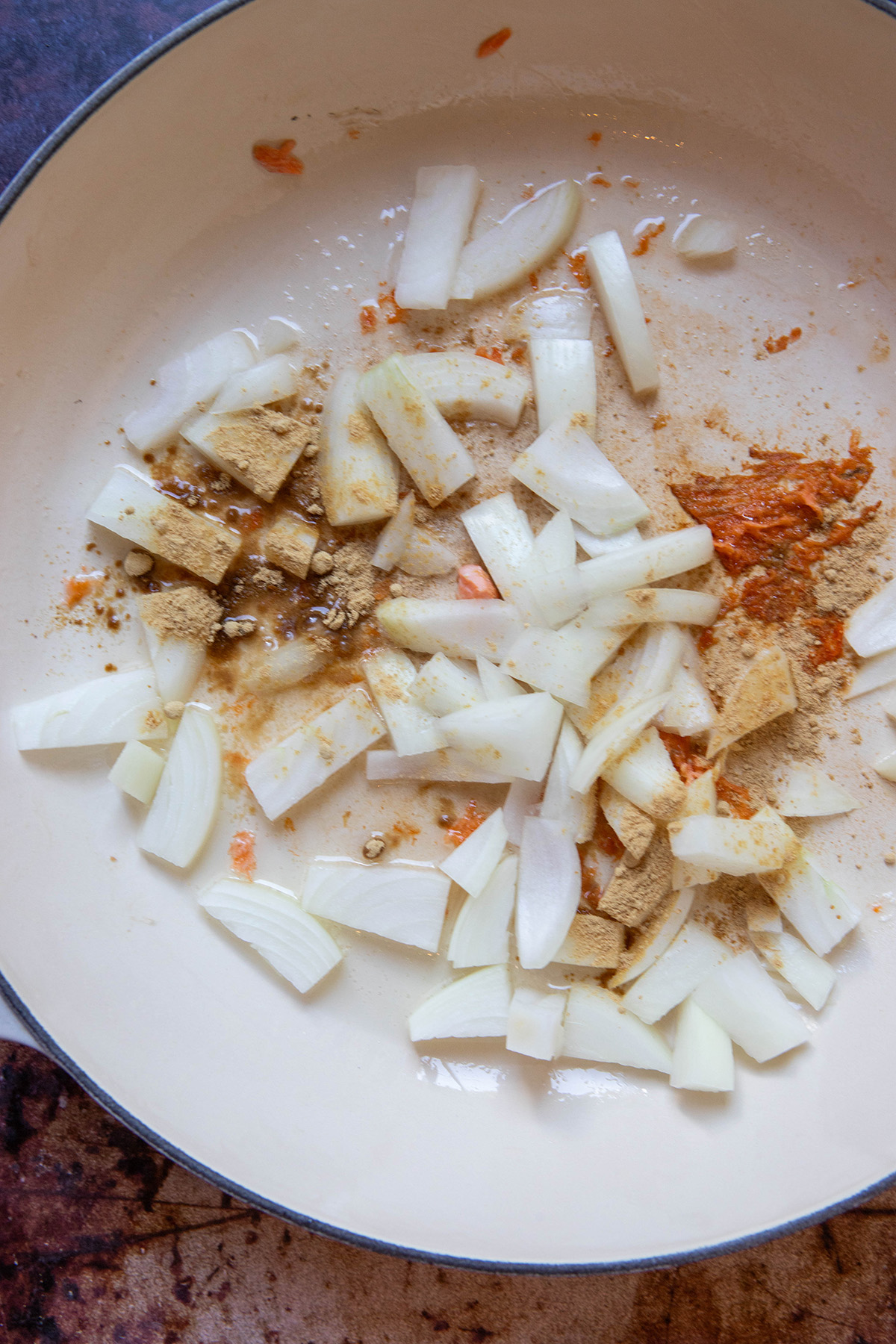 chopped onion and spices in a pan