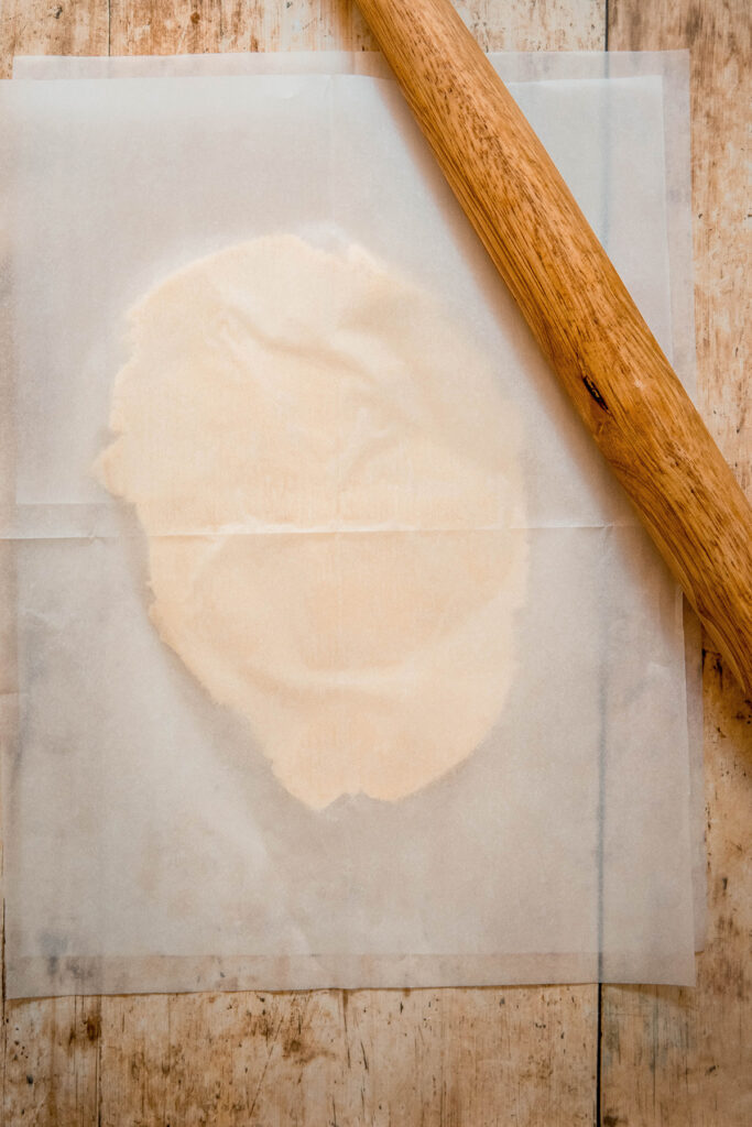 pastry dough between parchment 