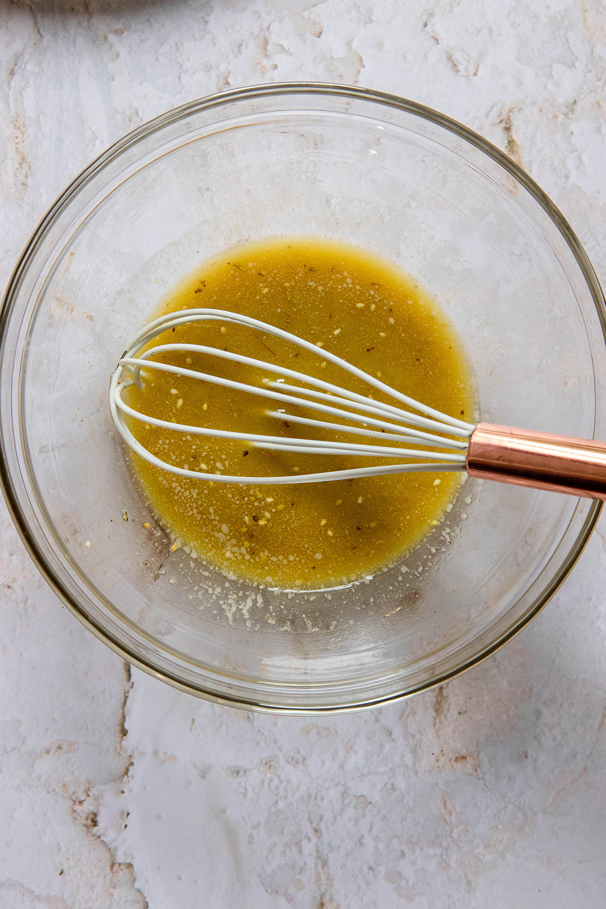 sauce with a whisk in a bowl