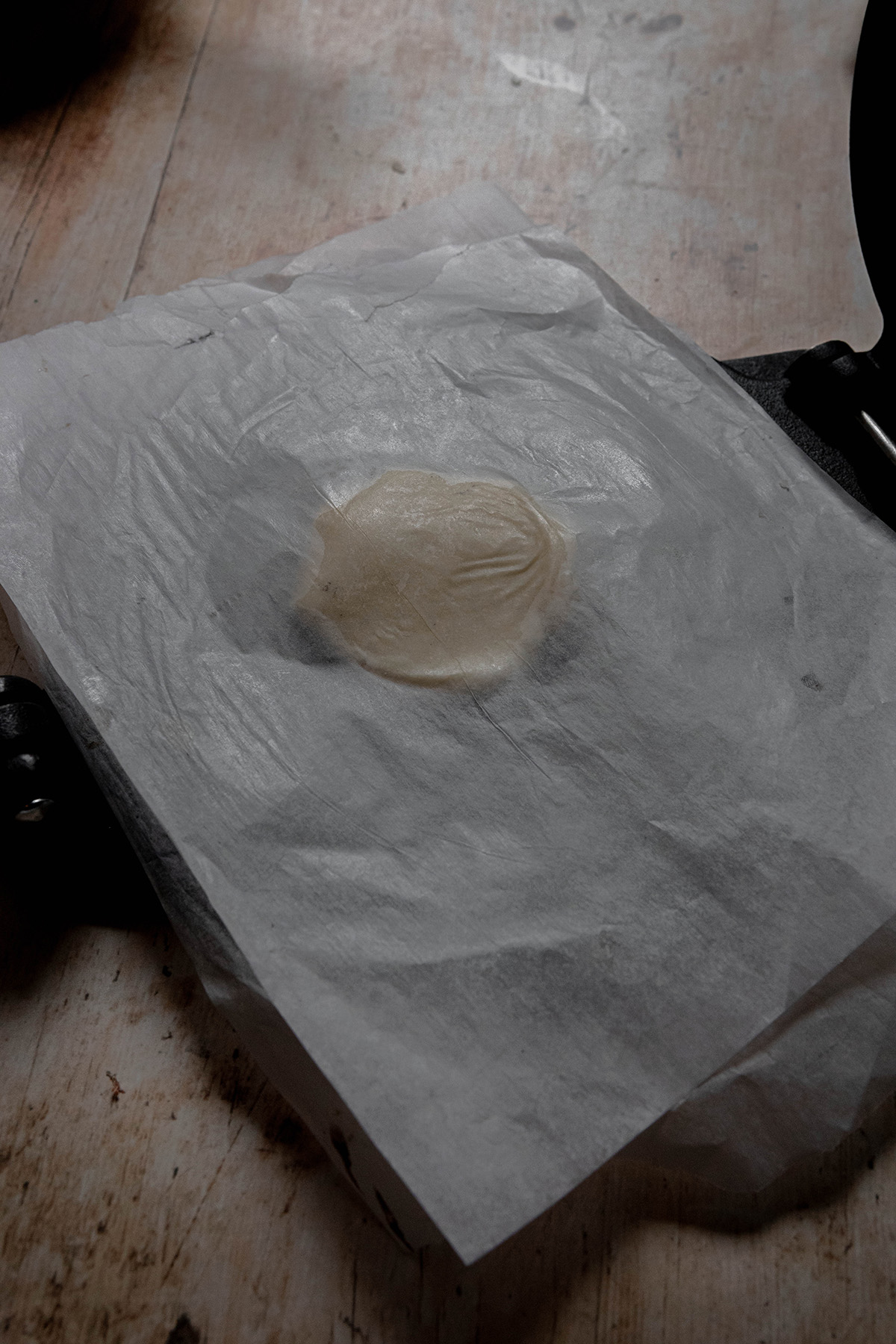 empanada dough between parchment paper