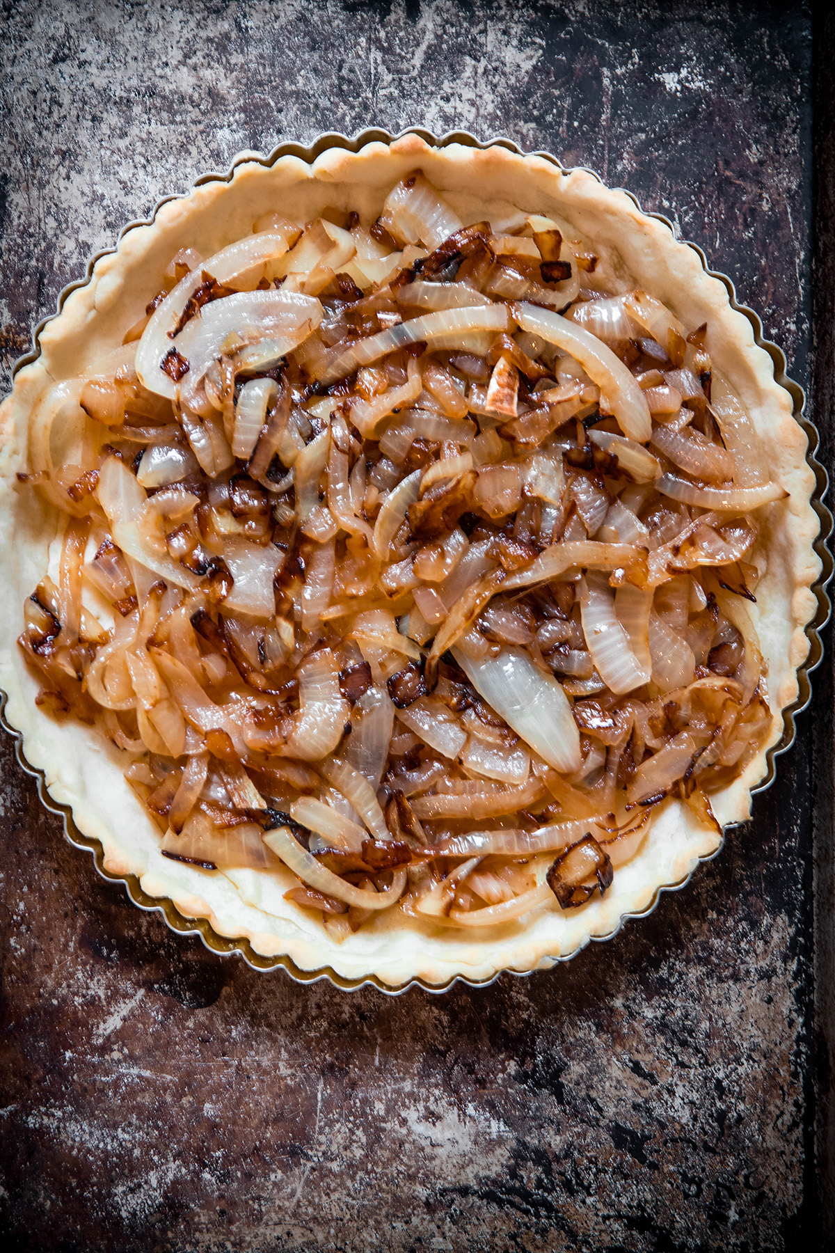 tart shell lined with caramelized onions