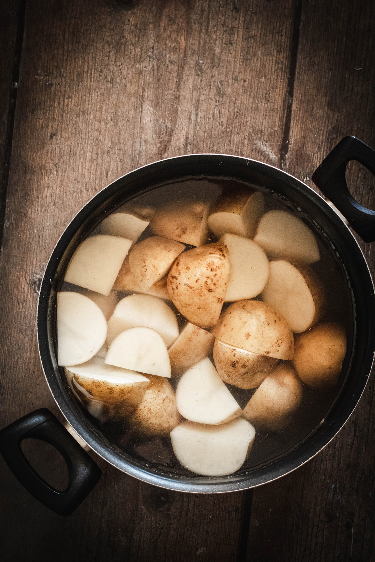 potatoes with water in a pot