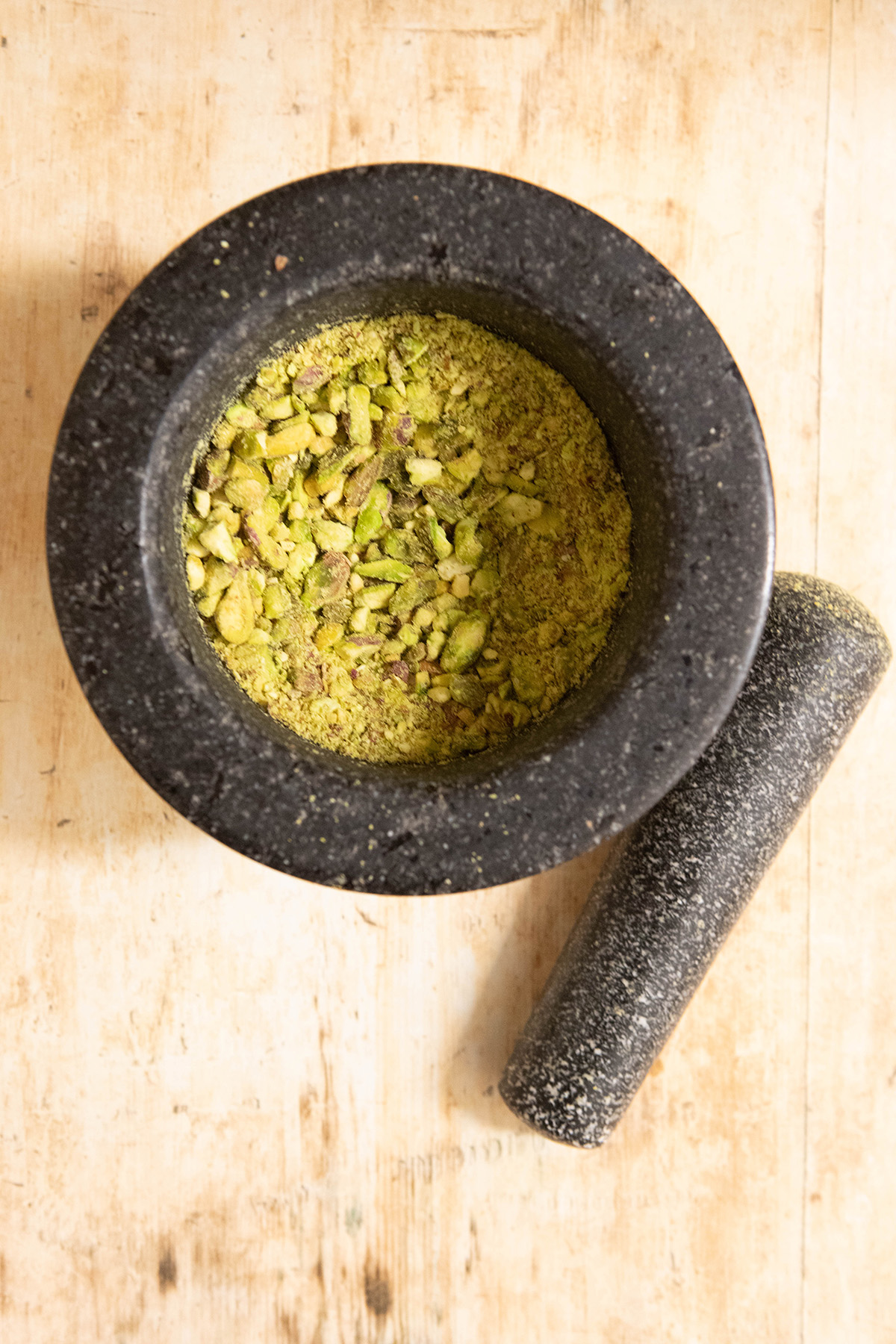pistachios in a mortar and pestle