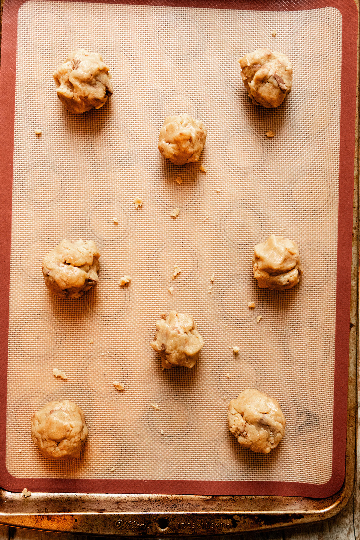 Cookie dough balls on a sheet pan