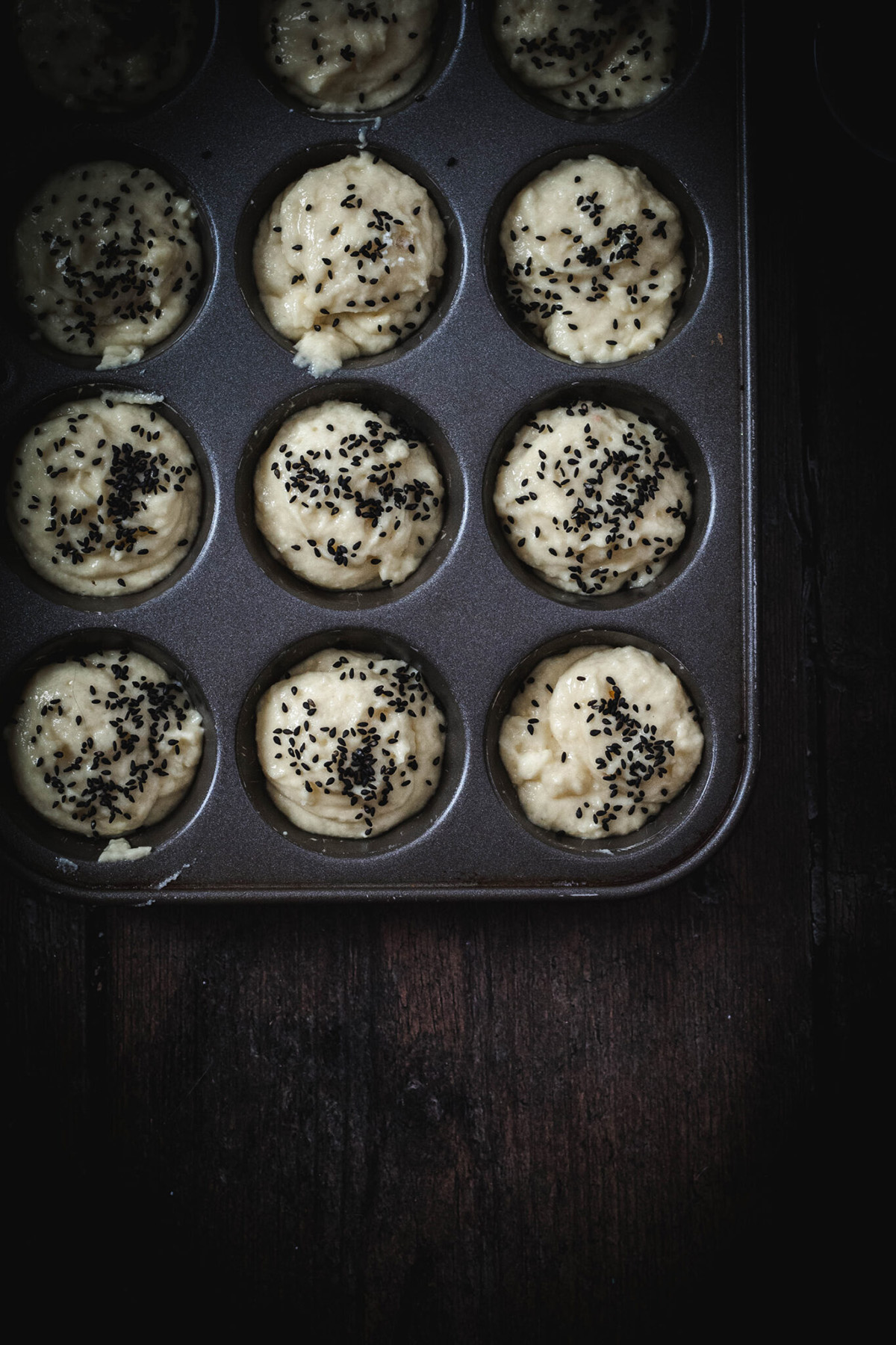 rice muffin batter in a muffin tin 